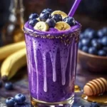 Healthy Banana-Blueberry Smoothie in a glass with fresh fruits
