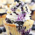 Delicious blueberry cream cheese cupcakes on a decorative plate.