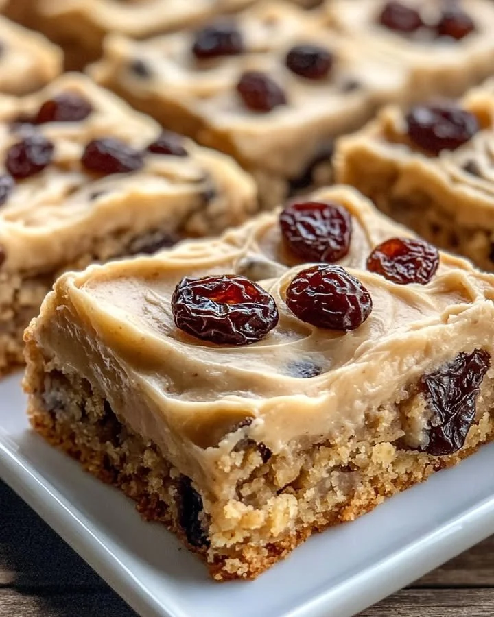 Delicious brown butter oatmeal raisin cookie bars served on a rustic plate