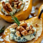 Delicious caramelized pears drizzled with blue cheese dressing on a plate.