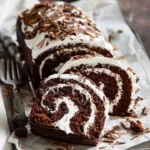 Delicious Chocolate Almond Cake Roll with cream filling and almond toppings