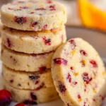Citrus-kissed shortbread coins on a decorative plate