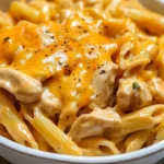 Creamy honey BBQ chicken and cheddar pasta dish served in a bowl
