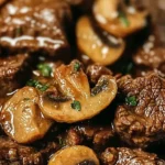 Crockpot beef tips with mushrooms served in a rustic dish