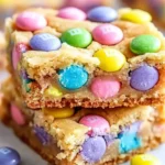 Colorful Easter cake mix cookie bars decorated with sprinkles.