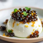 Espresso Pearls served on whipped mascarpone with orange zest garnish