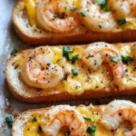 Garlicky shrimp ciabatta sandwich with melted cheddar jack cheese, served on crusty bread