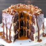 Gooey chocolate hazelnut caramel layer cake with rich frosting and toppings
