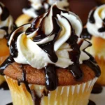 Delicious Boston Cream Pie Cupcakes topped with chocolate glaze
