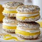 Lemon and poppy seed meringue sandwiches topped with creamy filling