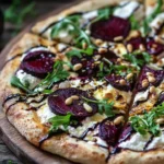 Lemon & Roasted Beet Ricotta Pizza topped with fresh ingredients and vibrant colors