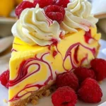Lemony raspberry swirl cheesecake topped with fresh berries