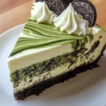 Matcha Oreo Swirl Cheesecake with green matcha and Oreo cookie crust