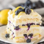 Delicious no-bake lemon dazzling blueberry cream cake with blueberries and cream
