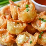 Crispy shrimp and cream cheese wontons on a platter