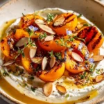 Plate featuring Smoky Stone Fruit and Herbed Cheese Delight for gourmet dining