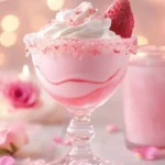 Refreshing Strawberry Rose Mocktini cocktail garnished with fresh strawberries and rose petals.
