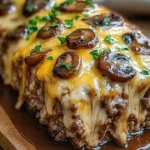 Delicious mushroom swiss cheese meatloaf garnished with herbs