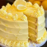 Delicious Velvet Lemon Cream Layer Cake with lemon zest and creamy frosting.